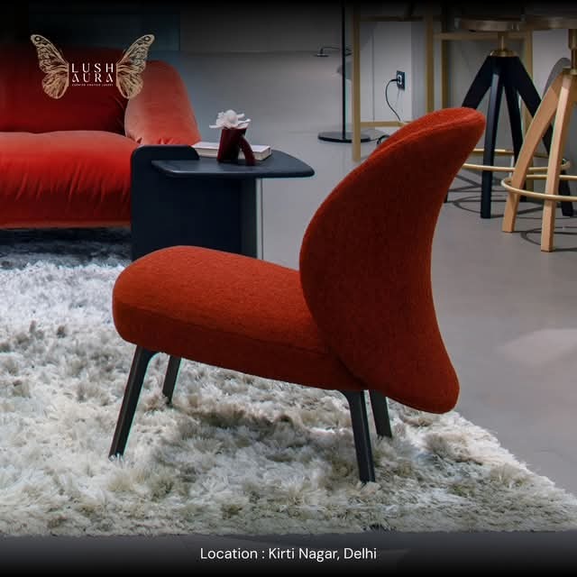 Rust Curved-Back Lounge Chair with Dark Legs
