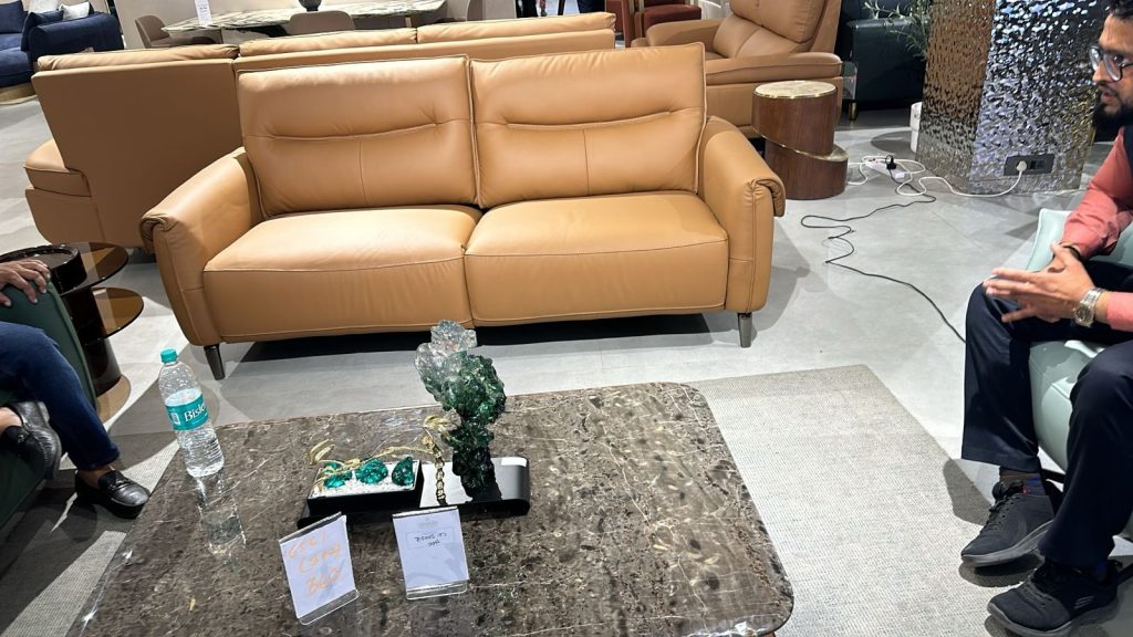 Tan Cushioned Three-Seat Sofa with Rounded Arms